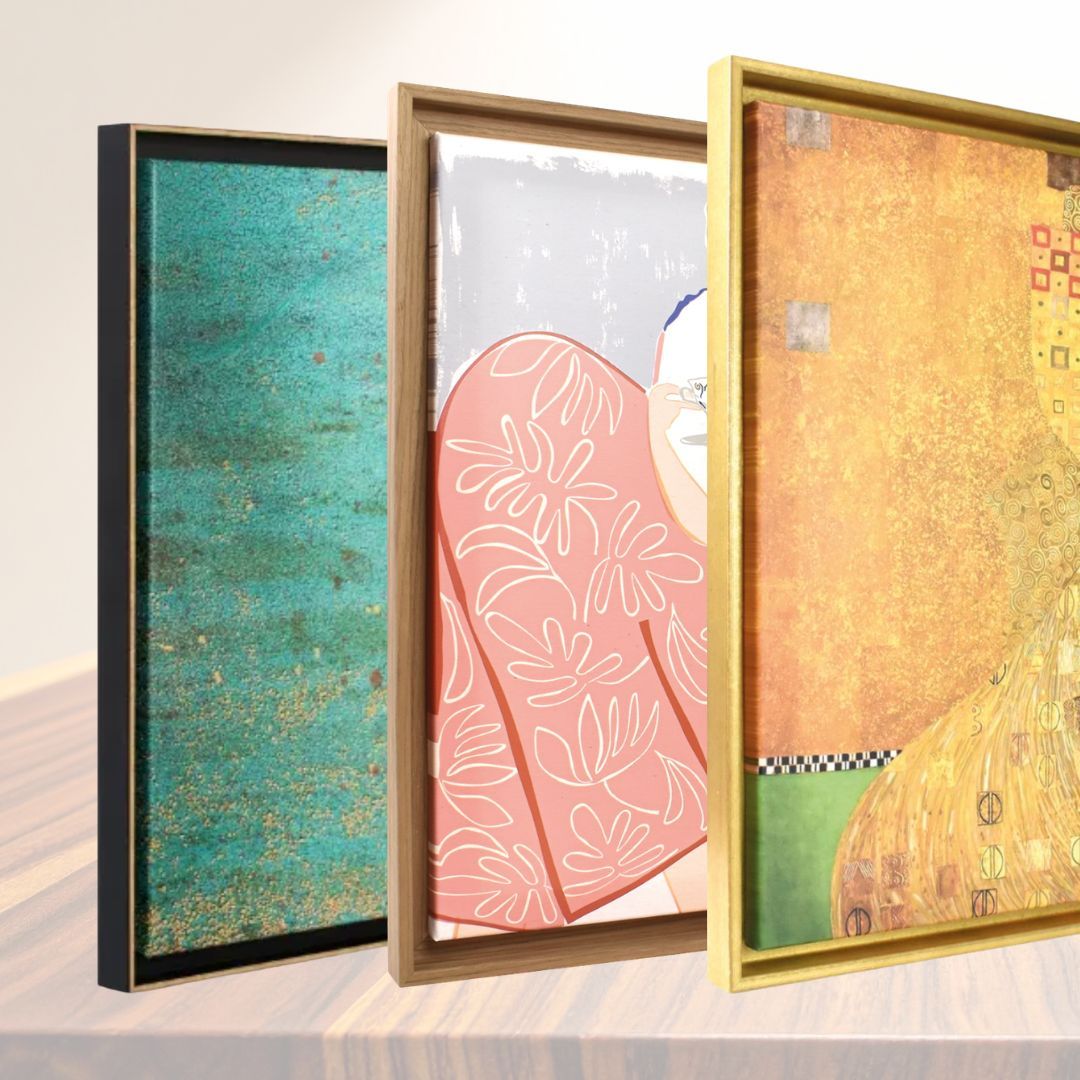 Three framed artworks with colorful abstract designs in black, brown, and gold frames.