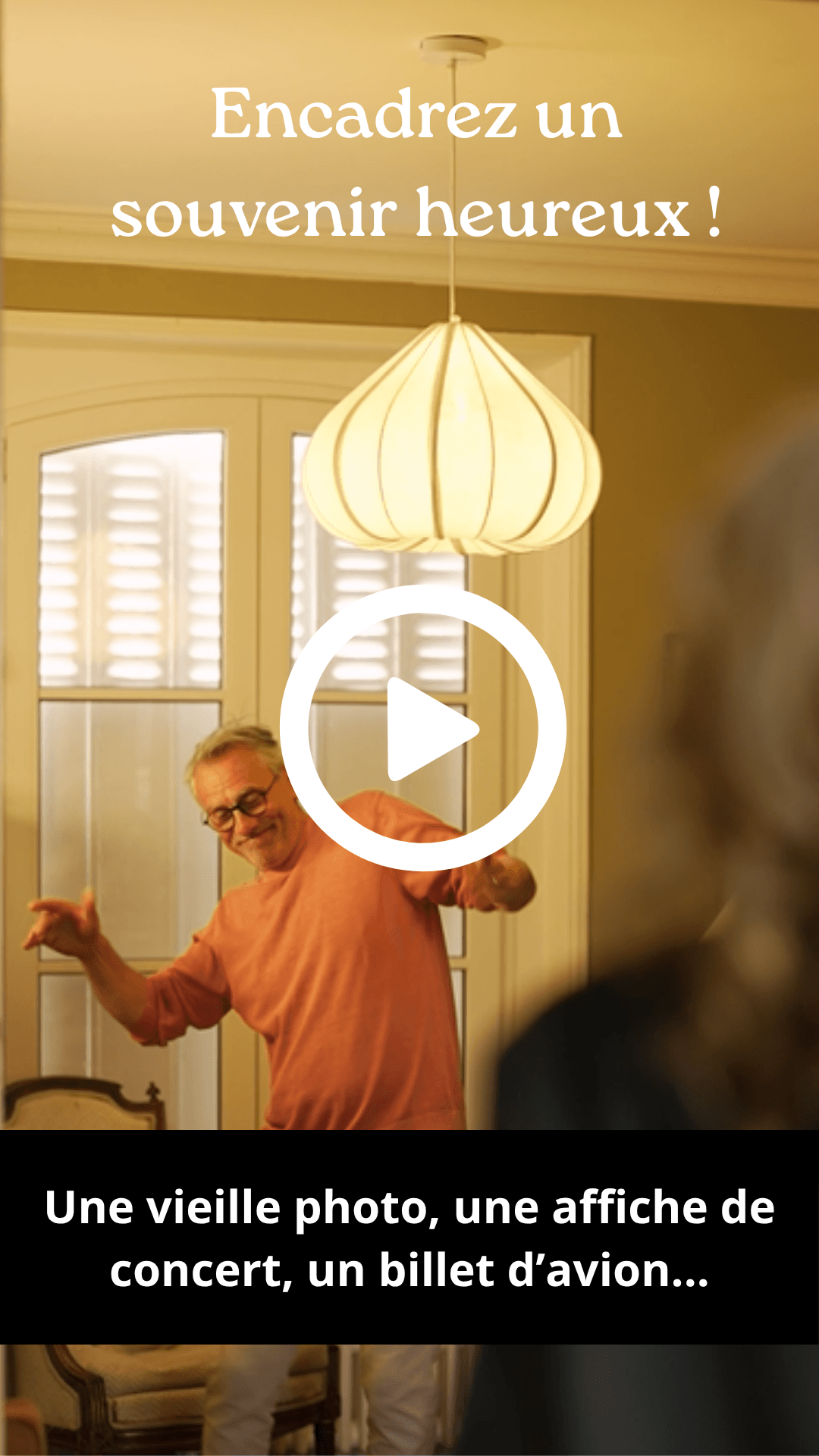 Man in orange shirt dancing joyfully in a room, with text 'Frame a happy memory!'