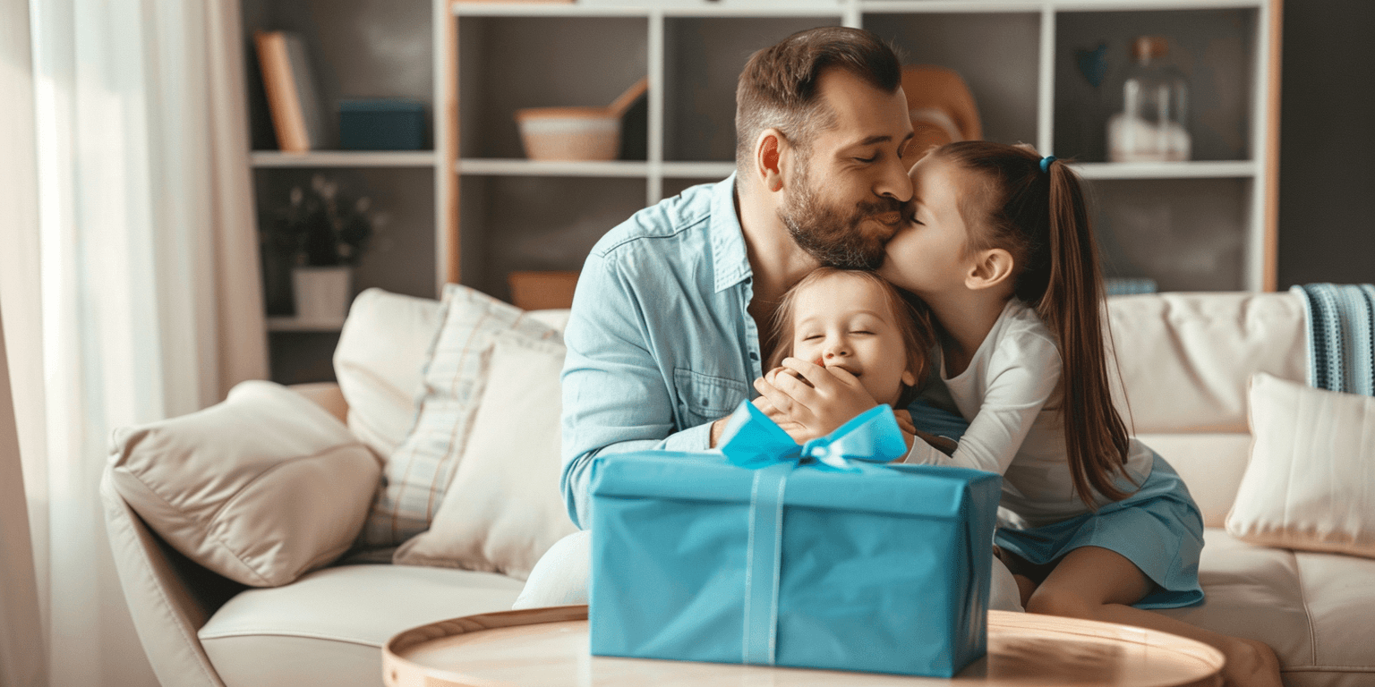 Father receives a blue gift from his two loving daughters.