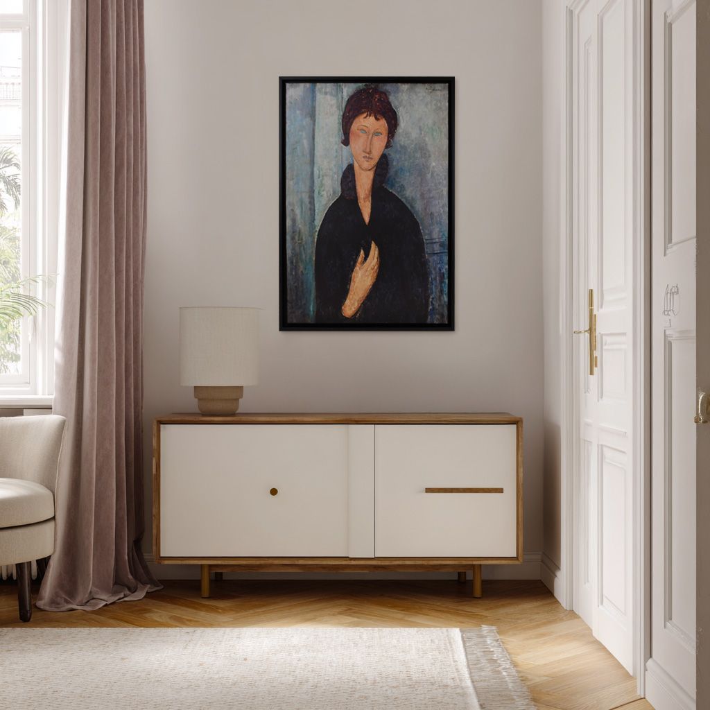 Modern hallway with a wooden sideboard beneath a framed portrait of a woman.