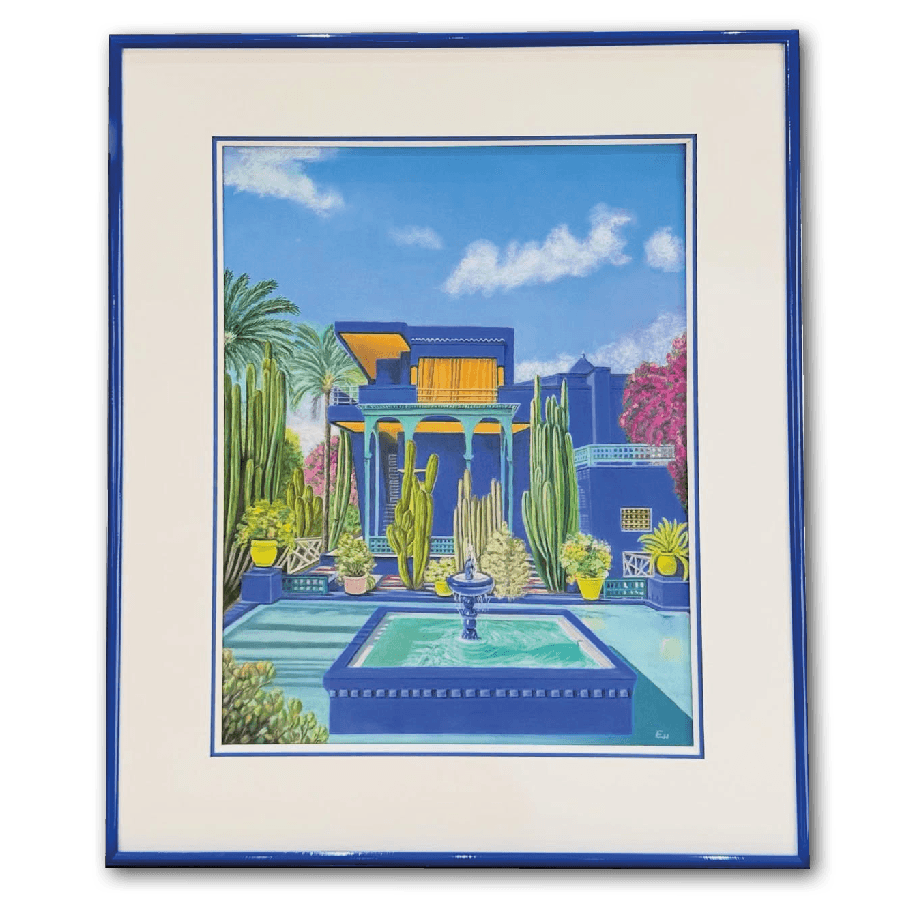 A vibrant blue building with a courtyard garden featuring a fountain and lush greenery.